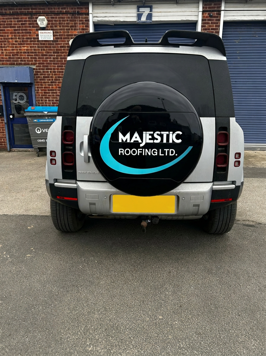 Majestic Roofing branded Land Rover Defender rear view